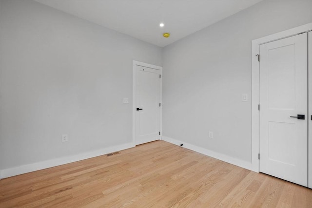 7 Denvir St Unit 2, Boston, MA 02124 - unfurnished room with wood finished floors, baseboards, and recessed lighting