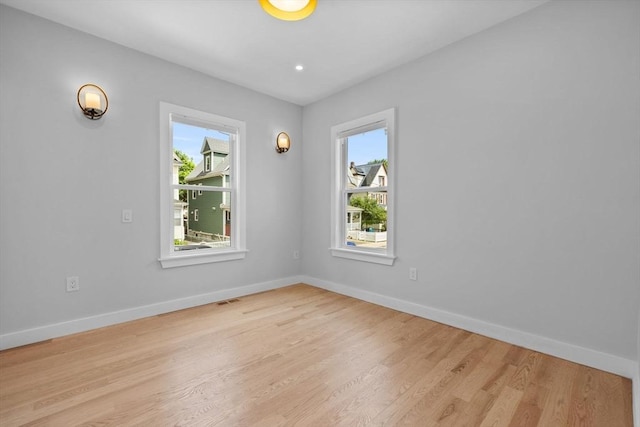 7 Denvir St Unit 2, Boston, MA 02124 - empty room with healthy amount of natural light, light wood-style floors, and baseboards