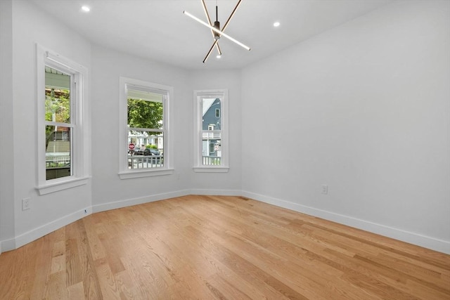 7 Denvir St Unit 2, Boston, MA 02124 - empty room with a chandelier, light wood-type flooring, baseboards, and recessed lighting
