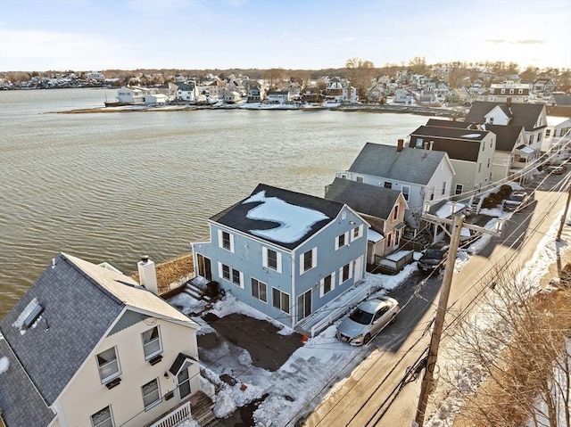 bird's eye view featuring a residential view and a water view