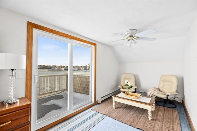 living area featuring baseboards, a ceiling fan, baseboard heating, vaulted ceiling, and carpet flooring