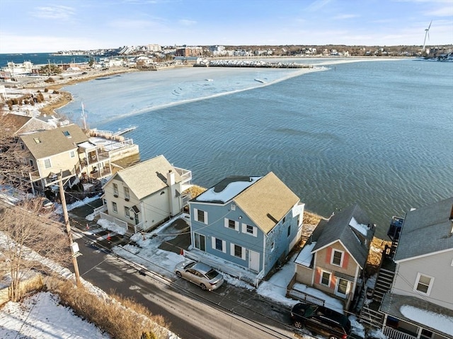 drone / aerial view featuring a water view and a residential view