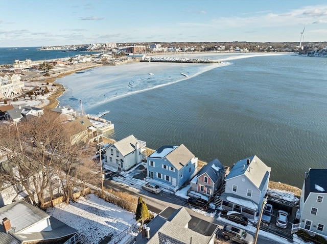 drone / aerial view featuring a water view and a residential view