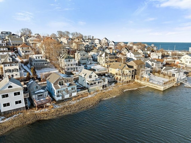 birds eye view of property featuring a water view and a residential view