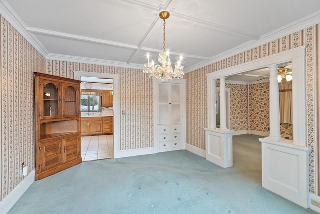 unfurnished dining area with wallpapered walls, decorative columns, ornamental molding, and light colored carpet