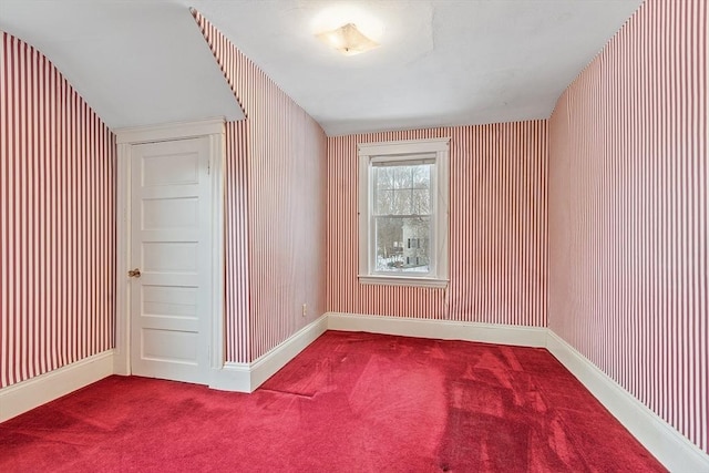 bonus room with carpet flooring and baseboards