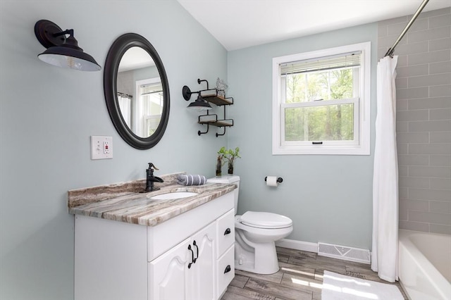 286 Narrow Ave, Westport, MA 02790 - bathroom with wood finished floors, vanity, toilet, baseboards, and shower / tub combo with curtain