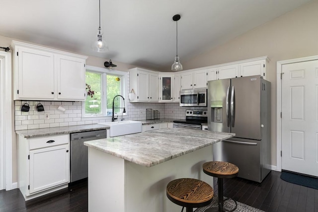 286 Narrow Ave, Westport, MA 02790 - kitchen featuring appliances with stainless steel finishes, a sink, dark wood-style floors, vaulted ceiling, and tasteful backsplash