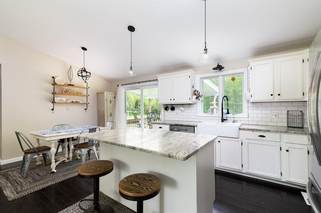 286 Narrow Ave, Westport, MA 02790 - kitchen with a sink, backsplash, dark wood-style floors, white cabinets, and vaulted ceiling