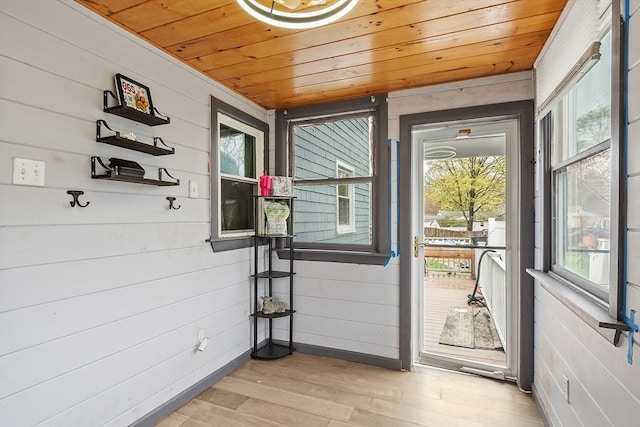 92 Hilltop Rd, Whitman, MA 02382 - entryway with baseboards, light wood finished floors, wood ceiling, and wood walls