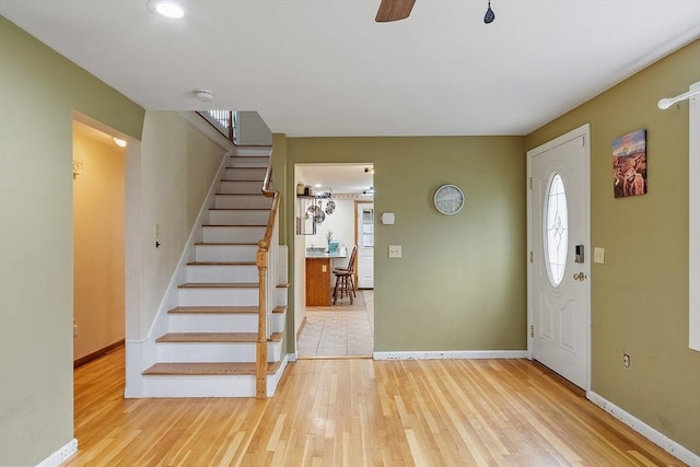 92 Hilltop Rd, Whitman, MA 02382 - foyer with baseboards, wood finished floors, stairway, and a healthy amount of sunlight
