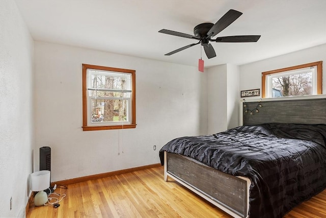 92 Hilltop Rd, Whitman, MA 02382 - bedroom featuring baseboards, wood finished floors, and multiple windows