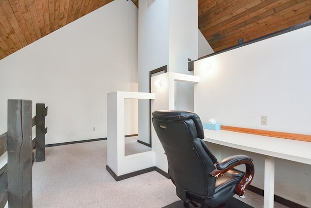 office featuring built in desk, light colored carpet, wood ceiling, and high vaulted ceiling