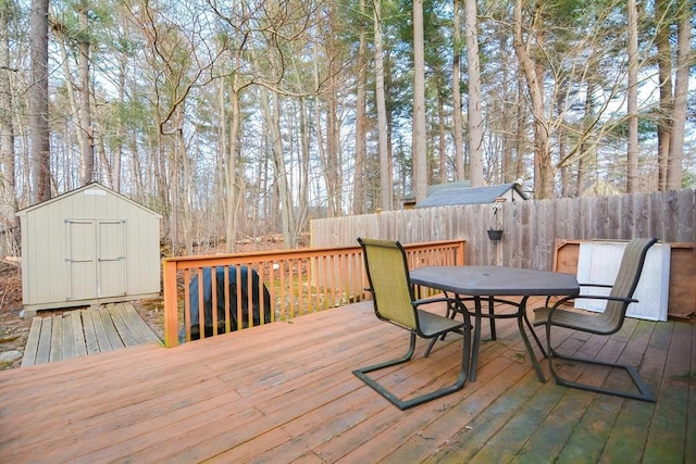 wooden deck featuring a storage shed