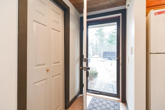 entryway with light tile patterned flooring