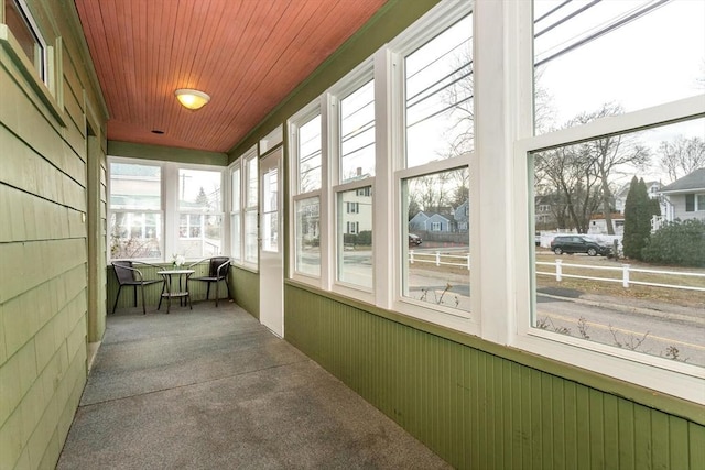 sunroom featuring wood ceiling