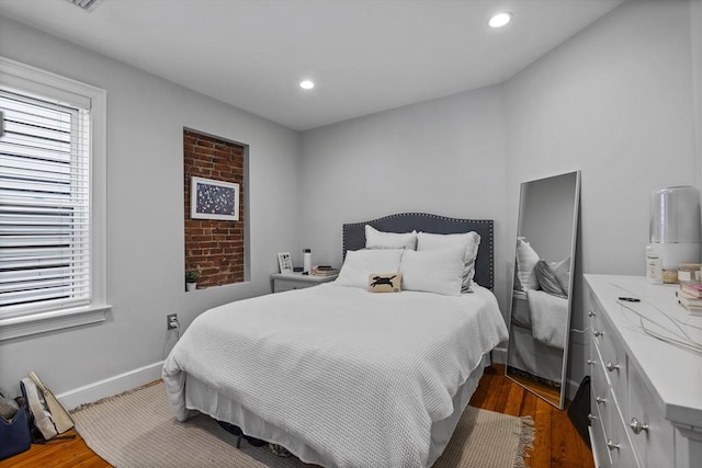 733 E 3rd St, Boston, MA 02127 - bedroom featuring multiple windows, dark wood-style flooring, recessed lighting, and baseboards