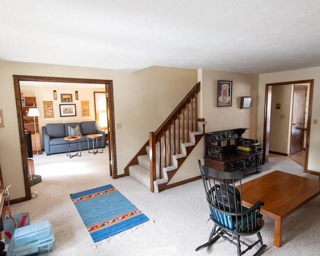 interior space featuring stairway and baseboards