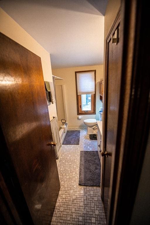 full bath featuring a shower stall, toilet, and vanity