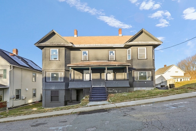 view of front of house featuring central air condition unit and covered porch