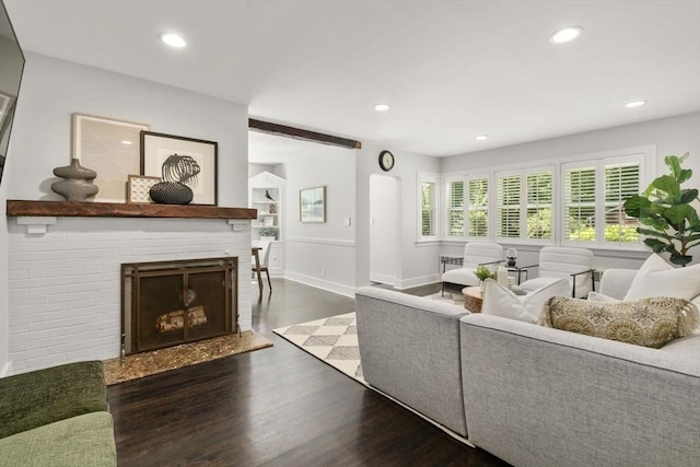 10 Morse Rd, Wayland, MA 01778 - living area with dark wood finished floors, a brick fireplace, recessed lighting, and arched walkways