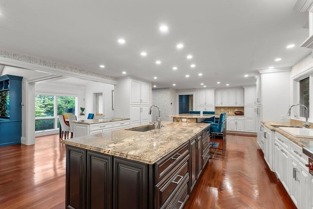 1 Croftdale, Newton, MA 02459 - kitchen featuring a sink, a large island, recessed lighting, and white cabinets