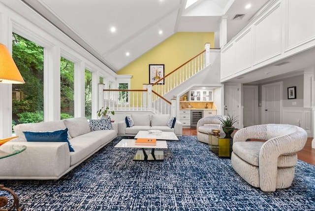1 Croftdale, Newton, MA 02459 - living area with high vaulted ceiling, stairs, wine cooler, wood finished floors, and recessed lighting