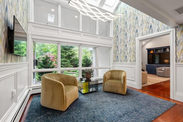 1 Croftdale, Newton, MA 02459 - sitting room with wallpapered walls, a decorative wall, a baseboard radiator, a skylight, and wainscoting