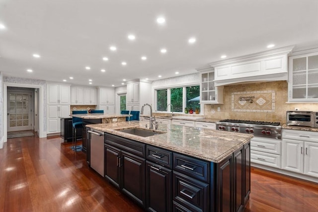 1 Croftdale, Newton, MA 02459 - kitchen with a sink, appliances with stainless steel finishes, a kitchen island with sink, white cabinetry, and recessed lighting