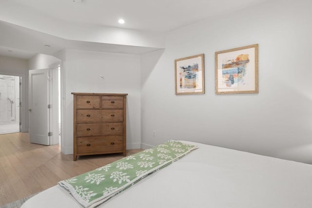 bedroom featuring recessed lighting, baseboards, and light wood finished floors