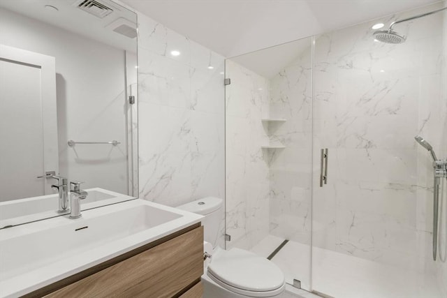 full bathroom with tile walls, a marble finish shower, visible vents, toilet, and vanity