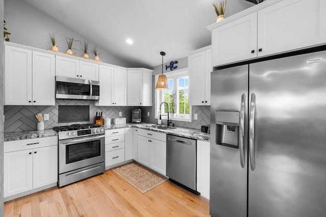 2 Jason Ter, Fairhaven, MA 02719 - kitchen with appliances with stainless steel finishes, a sink, light wood-style floors, vaulted ceiling, and white cabinets