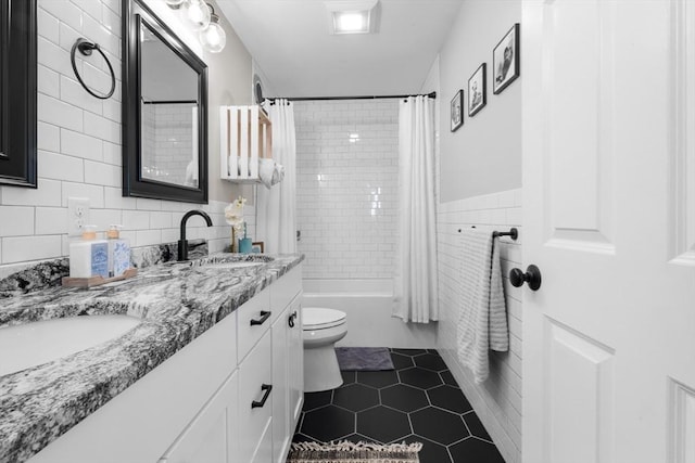 2 Jason Ter, Fairhaven, MA 02719 - bathroom featuring tile walls, toilet, tile patterned floors, double vanity, and shower / tub combo with curtain