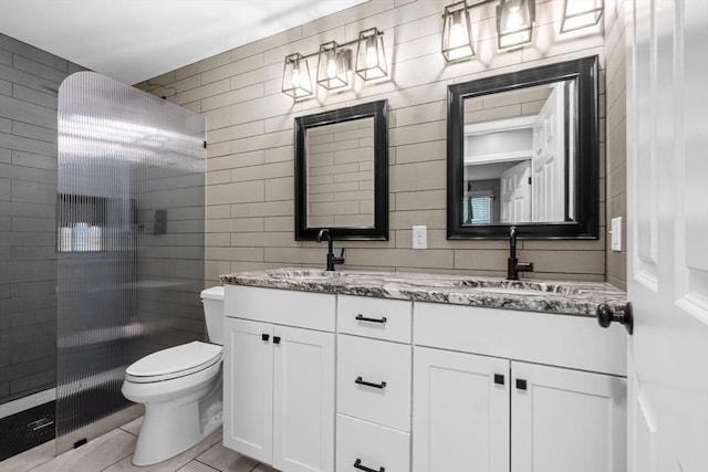 2 Jason Ter, Fairhaven, MA 02719 - full bathroom with double vanity, toilet, tiled shower, and tile patterned flooring