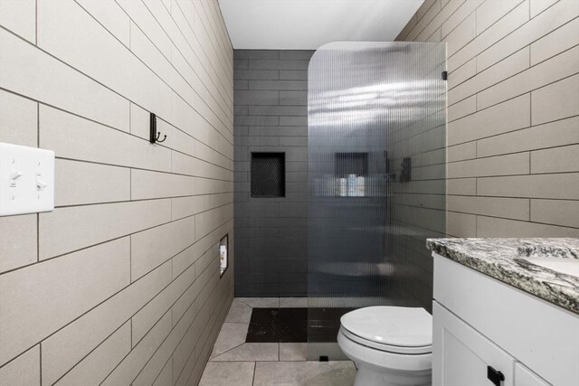 2 Jason Ter, Fairhaven, MA 02719 - full bathroom featuring vanity, tile walls, toilet, a tile shower, and tile patterned floors
