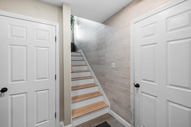 2 Jason Ter, Fairhaven, MA 02719 - stairway with wood walls, tile patterned floors, and baseboards
