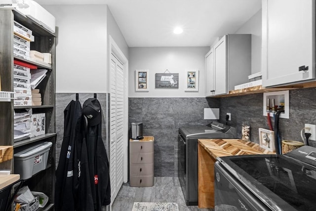 2 Jason Ter, Fairhaven, MA 02719 - kitchen with washer and clothes dryer, tile walls, white cabinets, and wainscoting