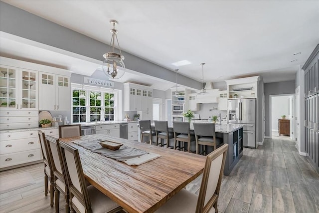 33 Freeman Dr, Plymouth, MA 02360 - dining space with light wood-style floors and lofted ceiling