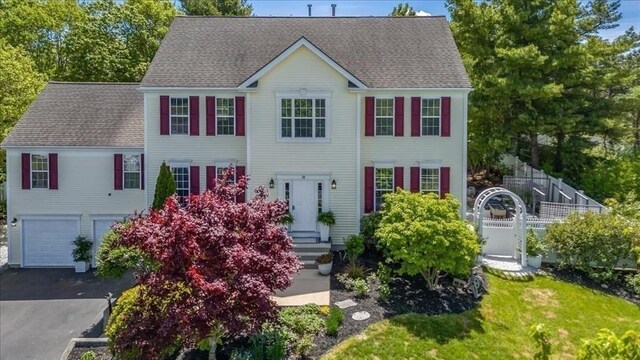 33 Freeman Dr, Plymouth, MA 02360 - colonial inspired home featuring an attached garage, asphalt driveway, and roof with shingles