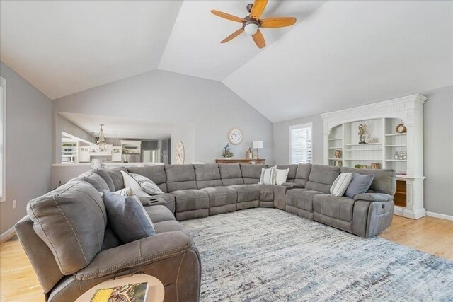 33 Freeman Dr, Plymouth, MA 02360 - living room featuring ceiling fan, wood finished floors, vaulted ceiling, and baseboards