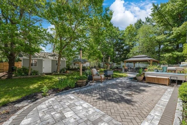 33 Freeman Dr, Plymouth, MA 02360 - view of patio / terrace with a covered hot tub, a gazebo, and an outbuilding