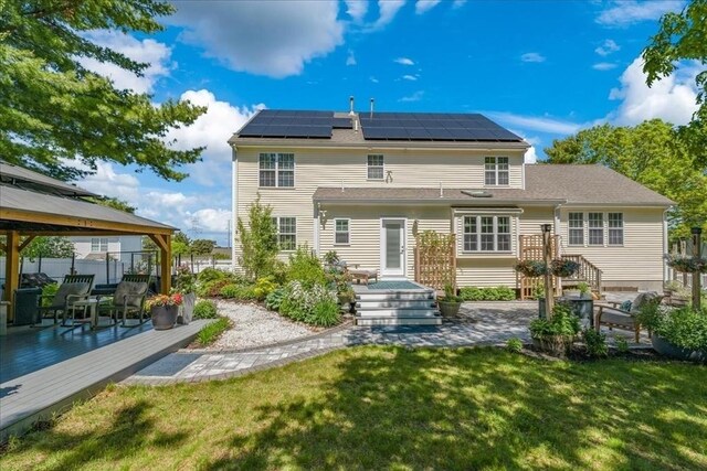 33 Freeman Dr, Plymouth, MA 02360 - back of house featuring a gazebo, solar panels, and a deck