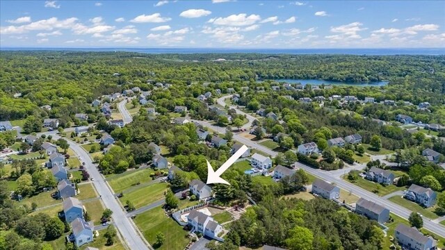 33 Freeman Dr, Plymouth, MA 02360 - view of property location featuring a heavily wooded area and a nearby body of water