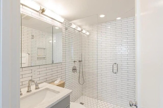 495 Commercial St Unit 9, Provincetown, MA 02657 - full bathroom with vanity, tile walls, and a shower stall
