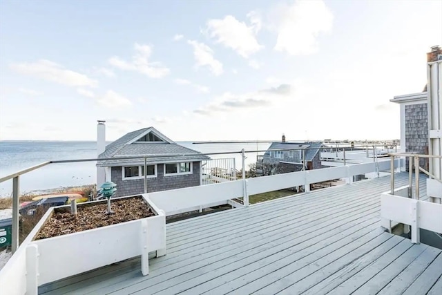 wooden terrace with a water view