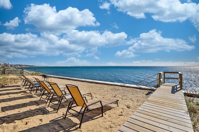 exterior space featuring a water view and a view of the beach