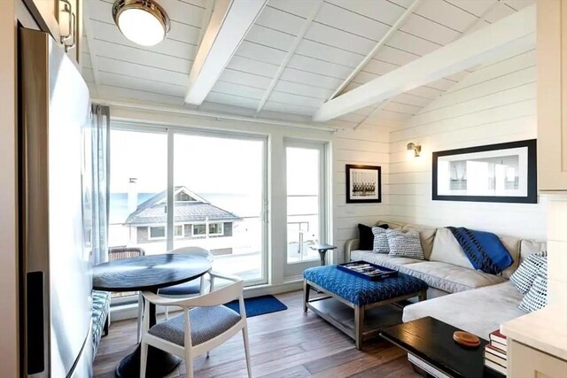 495 Commercial St Unit 9, Provincetown, MA 02657 - living area with wood finished floors, wooden ceiling, wooden walls, and breakfast area