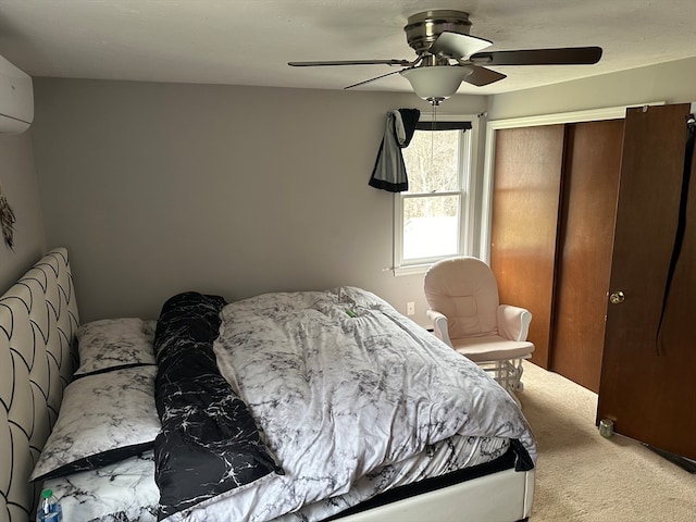 bedroom featuring a closet, light colored carpet, and ceiling fan