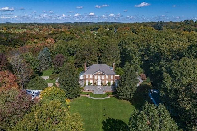 bird's eye view featuring a wooded view