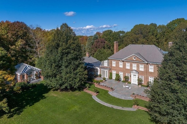 birds eye view of property with a forest view